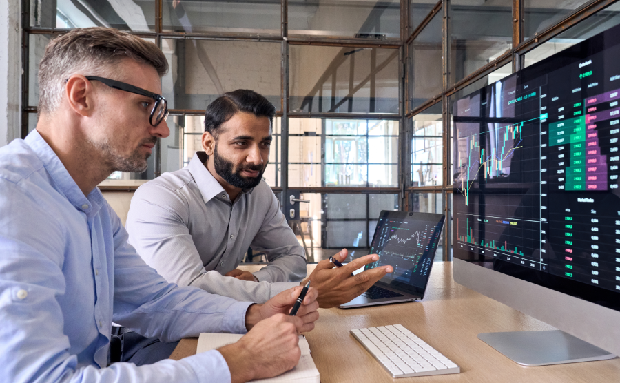 Two men analyzing data at a computer